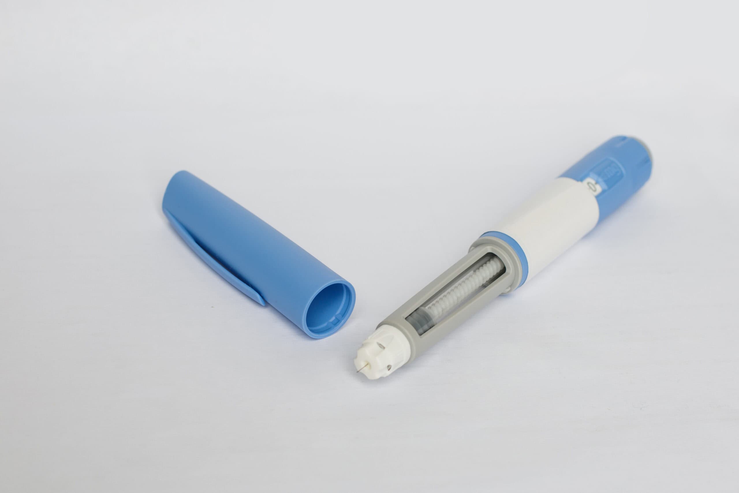 Close-up of a dosing pen used for self-administered subcutaneous injection