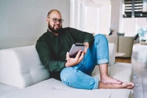 A man using a tablet at home
