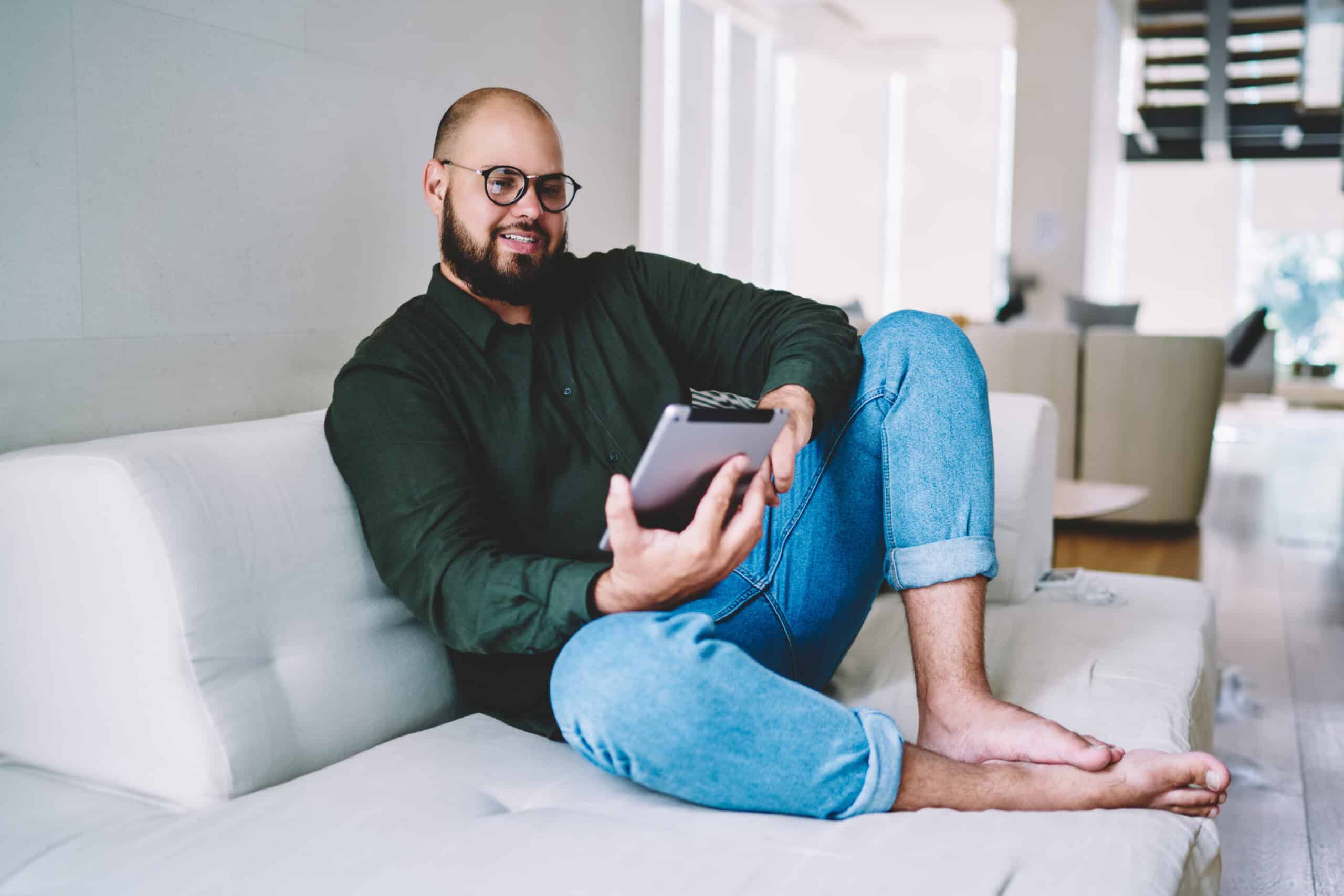 A man using a tablet at home