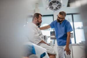A doctor talking with a patient in a hospital setting