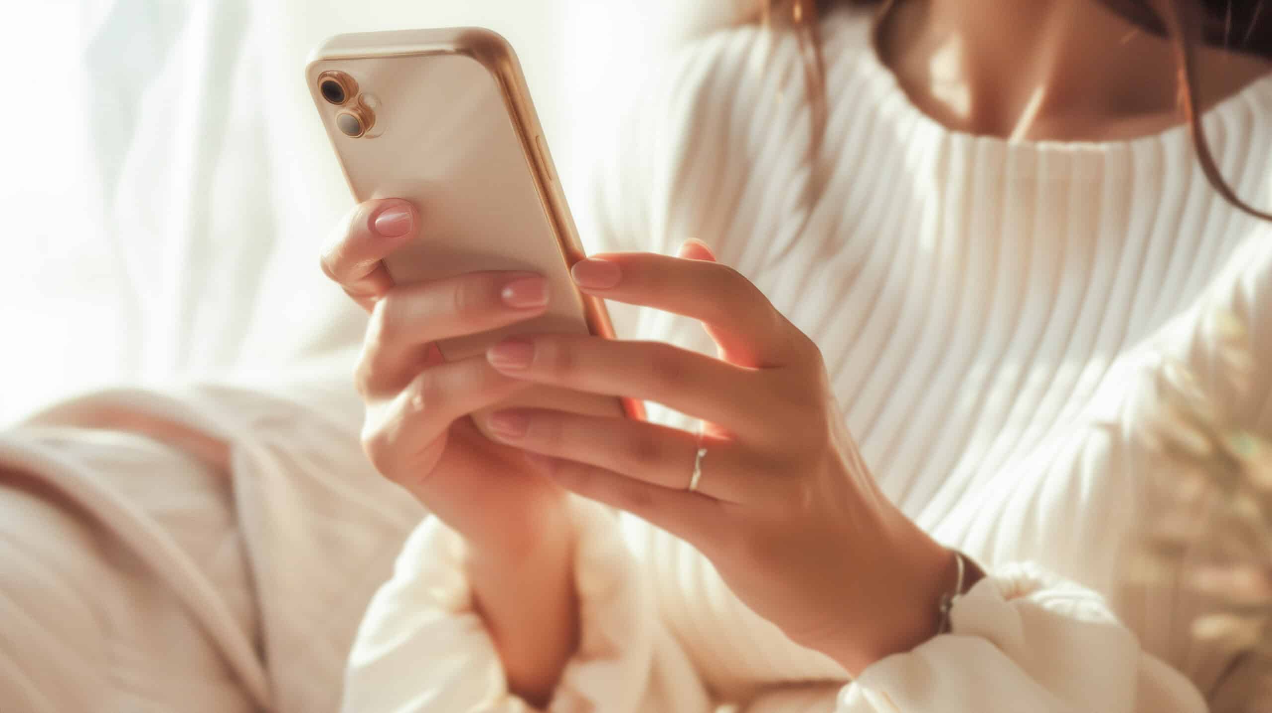 Close-up of someone using a phone at home